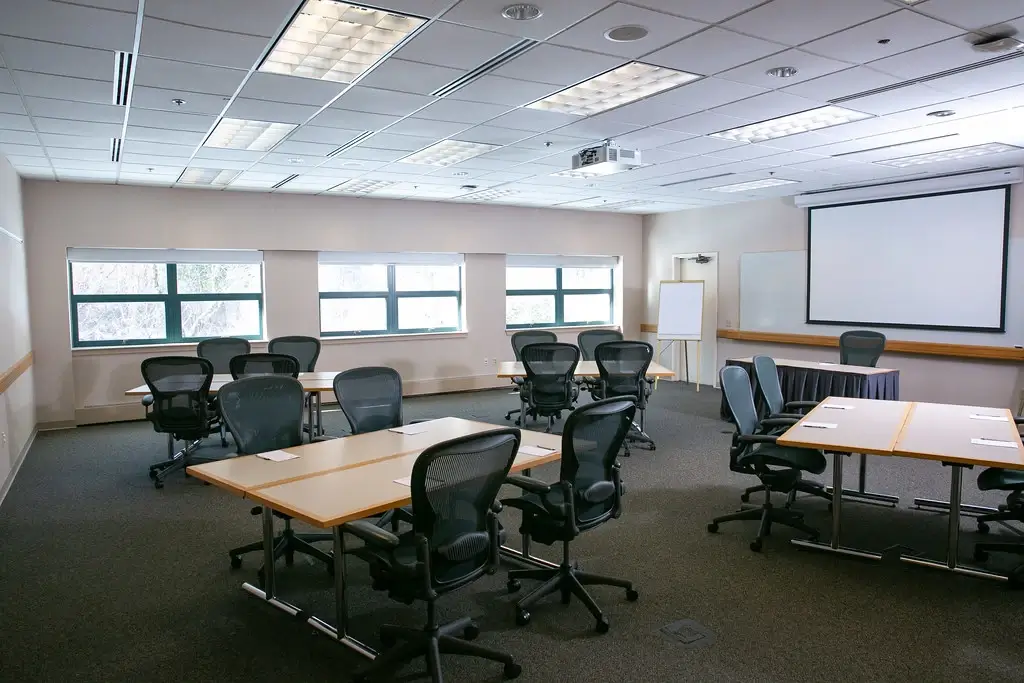 A standard conference room setup before branding
